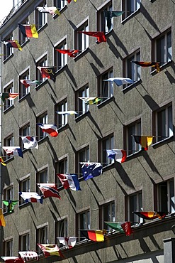 House with many international flags in the Reichsstrasse, Leipzig, Saxony, Germany