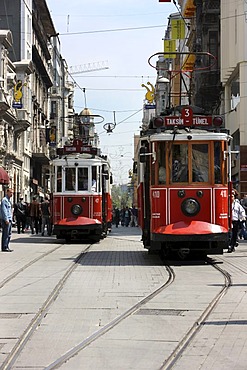 Trams passing through the main pedestrian zone, Istiklal Caddesi in the Boyoglu district, Sultanahmet, Istanbul, Turkey