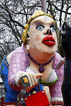 Busty paper-mache woman with collagen and botox needles sticking in her lips and face, Carnival (Mardi Gras) parade in Duesseldorf, North Rhine-Westphalia, Germany, Europe