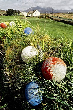 Scenery near Clifden, brightly painted floats of a fishing net, Connemara, County Galway, Ireland, Europe