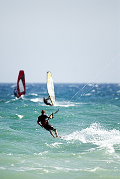 Kitesurfer and windsurfers, Mediterranean coast, Spain