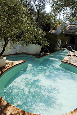 Phallus-shaped, phallic swimming pool in the garden at the former home of surrealist painter Salvador Dali and his wife Gala in Port Lligat, Province Girona, Spain