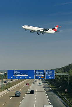 Aeroplane above the autobahn approaching the Airport, Frankfurt, Hesse, Germany