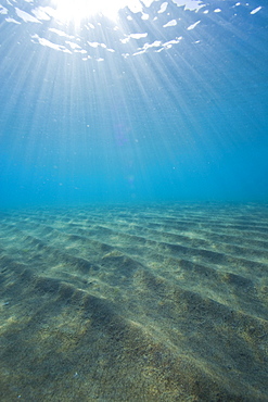 Sandy sea bottom with swell of waves