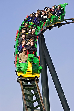 Teenagers riding a roller coaster