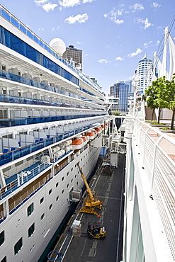 Passenger cruise liner "Diamond Princess" being loaded, docked in front of the Pan Pacific Hotel in Vancouver, British Columbia, Canada, North America