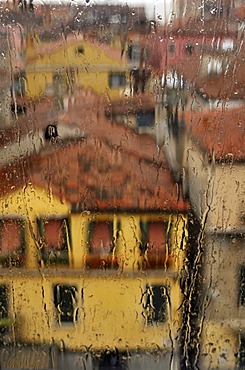 View of houses through a window with rain drops, Venice, Italy, Europe