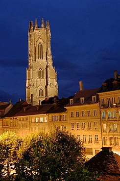 View over the roofs of old town buildings towards the Cathedral Saint Nicholas, Fribourg, Switzerland