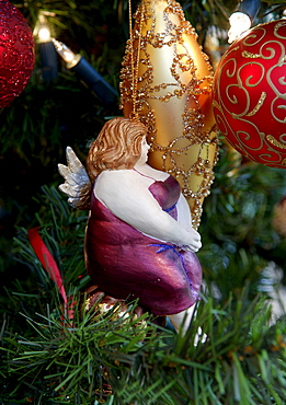 Christmas ornament, Christmas balls and figure of a plump woman wearing purple dress