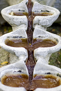 Flowing water in the silence park in the central cemetery in Vienna, Austria