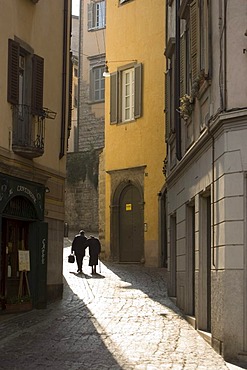 Couple in the old part of town, Bergamo, Lombardy, Italy