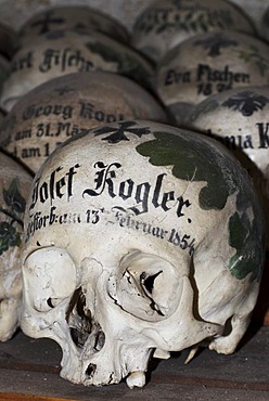 Painted skulls in the ossuary of Hallstatt, Salzkammergut, Upper Austria, Austria