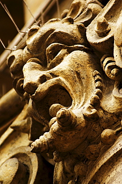 Stone face on a building facade in the historic centre of Prague, Czech Republic, Europe