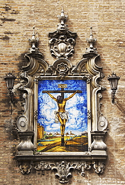 Picture of Jesus on the cross, ceramics, exterior wall of the church at Plaza de la Encarnacion, Seville, Andalusia, Spain