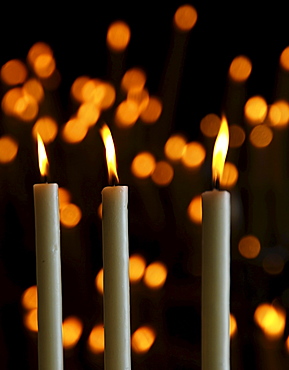 Votive candles in the side chapel of the church in El Rocio, Andalusia, Spain, Europe