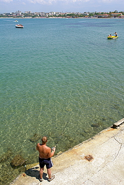 Fisherman at Side Bay, Side, Turkey.