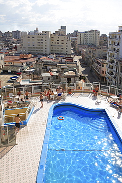 View of the old part of Havana with a resort swimming pool in the foreground, Havana, Cuba, Caribbean