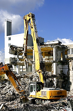 Wrecking excavator at a demolition site