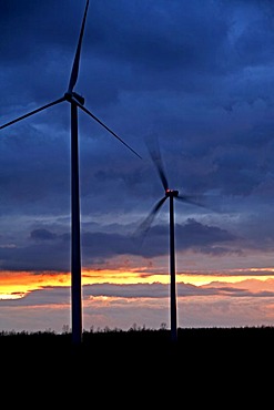 Wind turbines at sunset