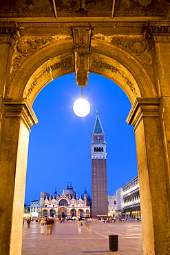 View through arcades towards Basilica di San Marco, St. Mark's Basilica and Campanile, evening mood, Venezia, Venice, Italy, Europe