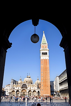 View through an arcade towards Basilica di San Marco, St. Mark's Basilica and Campanile, Venezia, Venice, Italy, Europe