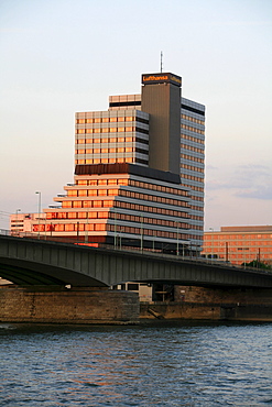 Lufthansa high-rise building and Deutzer Bruecke, Deutzer Bridge illuminated by the sunset at the Rhine River, Cologne, North Rhine-Westphalia, Germany, Europe