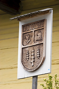 Sign with coat of arms, Vlkolinec, Slovakia