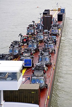 Military helicopter on a pushing unit on the rhine