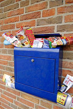 Advertising brochures in a mailbox