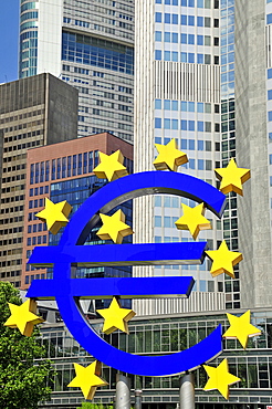 Euro symbol surrounded by stars, in front of multistory buildings, Eurotower of the European Central Bank, Frankfurt, Hesse, Germany