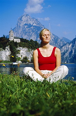 Blonde woman relaxing at the Traunsee Lake, Traunkirchen, Upper Austria, Europe