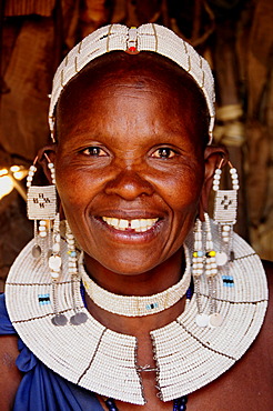 Massai woman with traditional headdress in Kiloki village, Serengeti, Tanzania, Africa