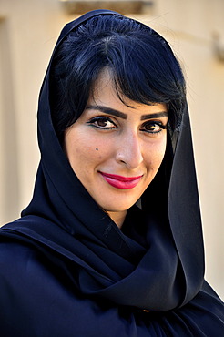 Native woman with veil in the Al-Jahili Fort of Al Ain, Unesco World Heritage Site, Abu Dhabi, United Arab Emirates, Arabian Peninsula, Orient, Asia