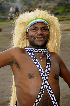 Traditional dancer during a folklore event in a village of former hunters near the village of Kinigi on the edge of the Volcanoes National Park, Parc National des Volcans, Rwanda, Africa