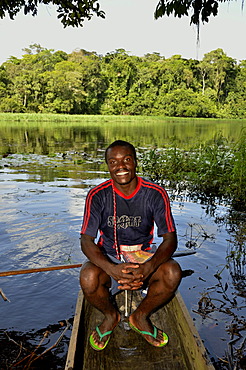 Tourist guide in a canoe on the Nyong river, near YaoundâˆšÂ©, Cameroon, Central Africa, Africa