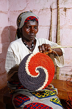 Woman making mats, place mats, from natural fibers, Bafut, Cameroon, Africa