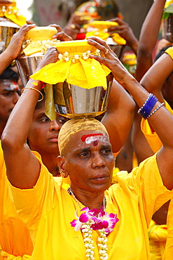 Pilgrim making a milk sacrifice, Hindu festival Thaipusam, Batu Caves limestone caves and temples, Kuala Lumpur, Malaysia, Southeast Asia, Asia