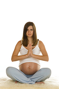 Pregnant woman practising yoga