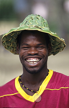 LCA, Saint Lucia: selling hats made of palm trees at the beach near Castries.