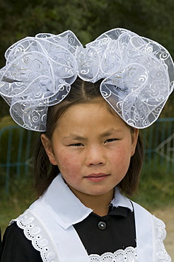 Portrait of a girl in traditional dress, Torugart, Kyrgyzstan, Central Asia