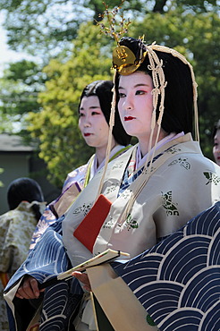 Court ladies of the royal household of the Saio dai, wearing the traditional headdress and kimono from the Heian Period, at the Kamigamo Shrine in Kyoto, Japan, Asia