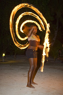 Fire artist performing at an evening event held for tourists in Honduras, Central America