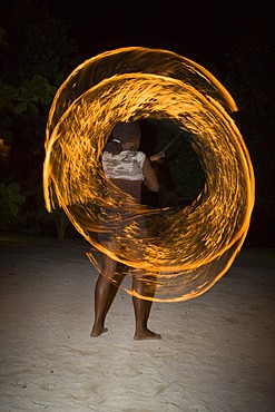 Fire artist performing at an evening event held for tourists in Honduras, Central America