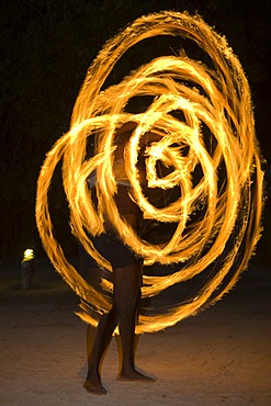 Fire artist performing at an evening event held for tourists in Honduras, Central America