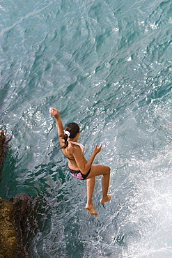 Young cliff jumper on the beach on the Promenade des Anglais in Nice, CÃ´te d\'Azur, Southern France, France, Europe