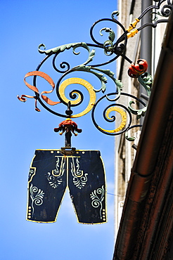 Hanging sign of a traditional costume shop, Residenzplatz square, Salzburg, Austria, Europe