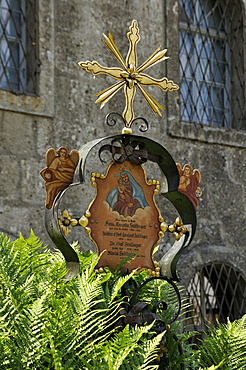 Old colourful wrought-iron cross on a grave, St. Peter's Cemetery, the oldest Christian burial site of Salzburg, St. Peter's district, Salzburg, Salzburg province, Austria, Europe