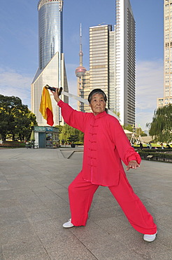 Old woman exercising, swordplay, Lujiazui Park, Oriental Pearl Tower, Pudong, Shanghai, China, Asia