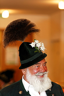 Man with white beard wearing a Gamsbart, traditional Bavarian dress hat, Upper Bavaria, Germany, Europe