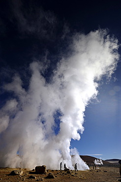 Geysers with water vapour against a deep blue sky, Uyuni, Bolivia, South America